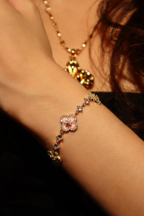 14K gold-plated lucky leaf bracelet with zirconia diamonds and pink resin accents