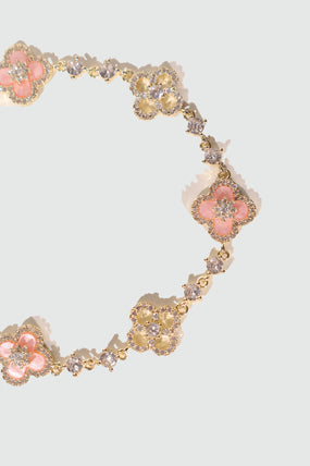 14K gold-plated lucky leaf bracelet with zirconia diamonds and pink resin accents
