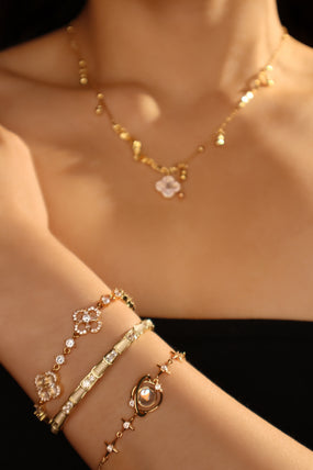 14K gold-plated stretch bracelet with white zirconia opals and zirconia diamonds