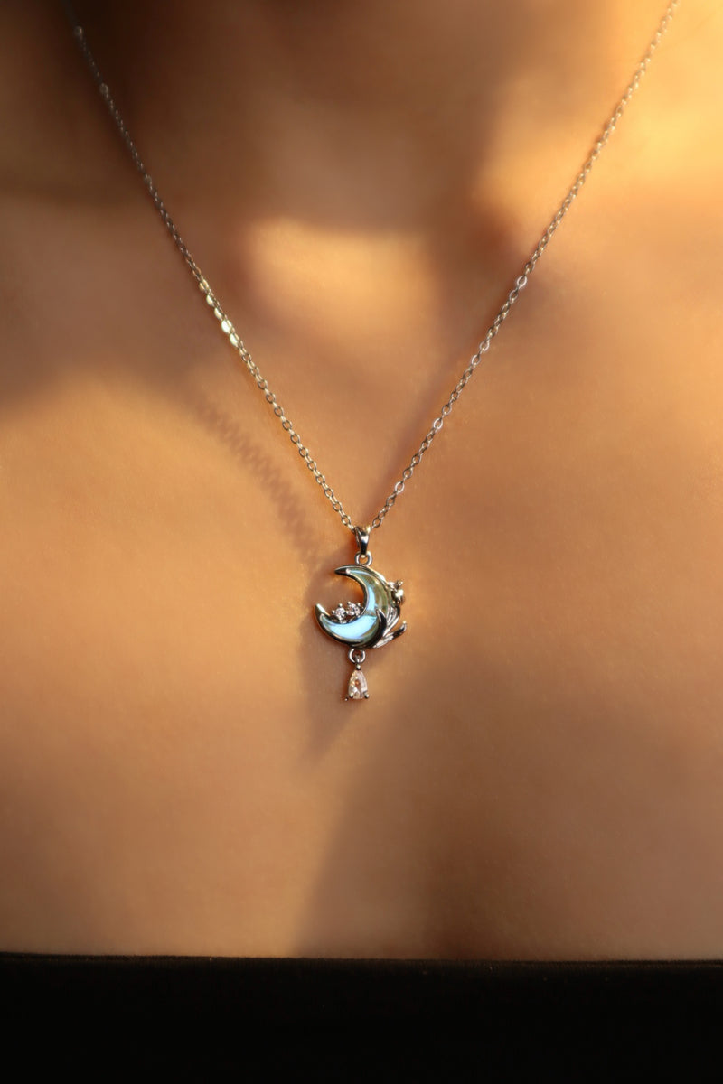 Rose and moon necklace with a blue zirconia moonstone and cut zirconia on a stainless steel chain