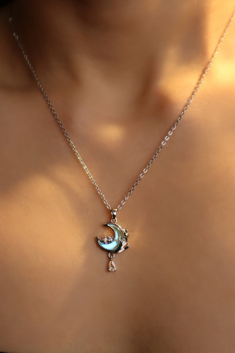 Rose and moon necklace with a blue zirconia moonstone and cut zirconia on a stainless steel chain