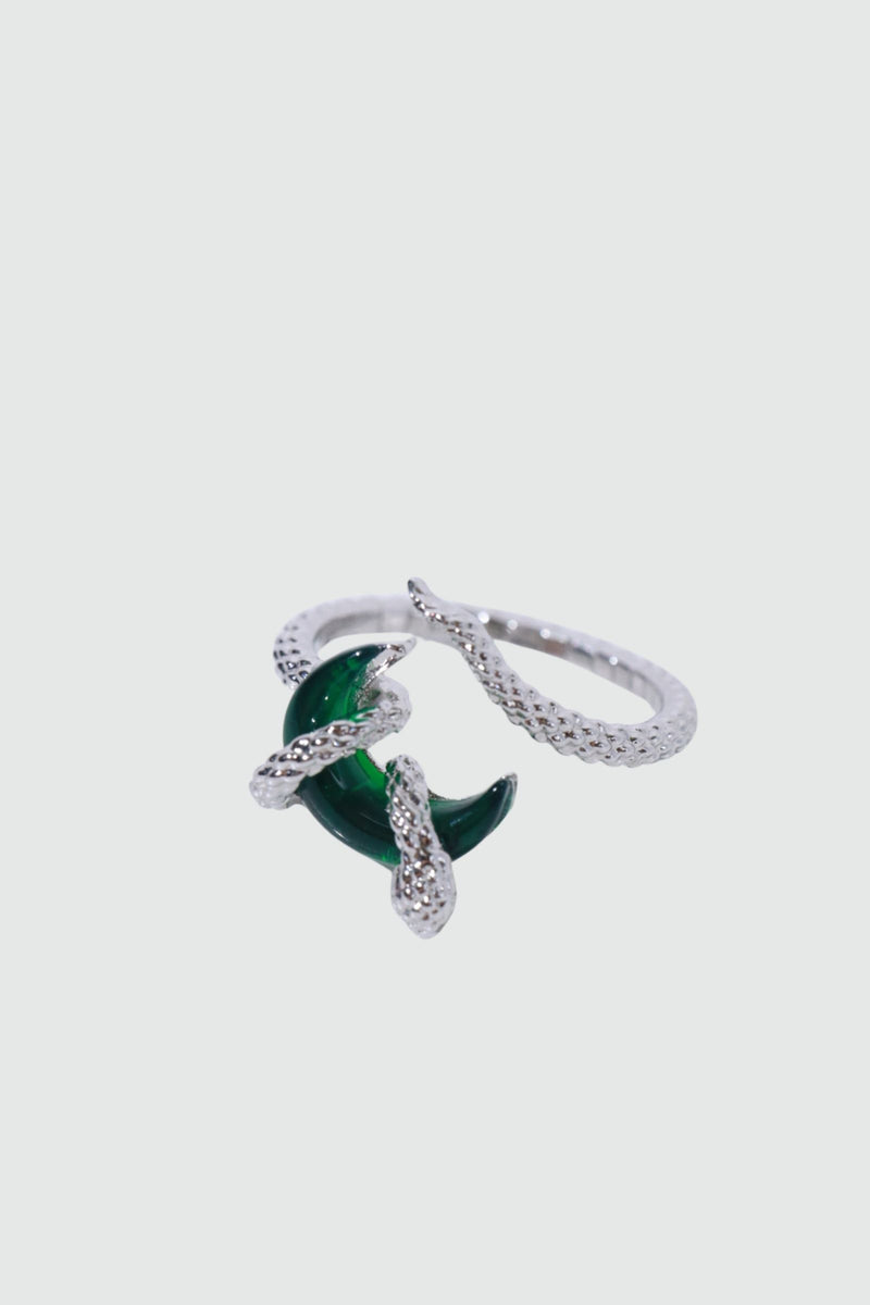 Silver-plated snake ring wrapped around a green zirconia moonstone, adjustable band