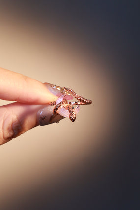 18K rose gold-plated snake ring wrapped around a zirconia moonstone