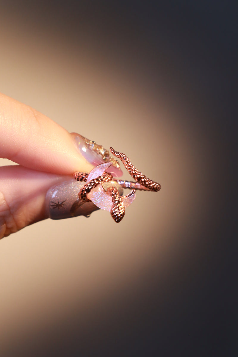 18K rose gold-plated snake ring wrapped around a zirconia moonstone