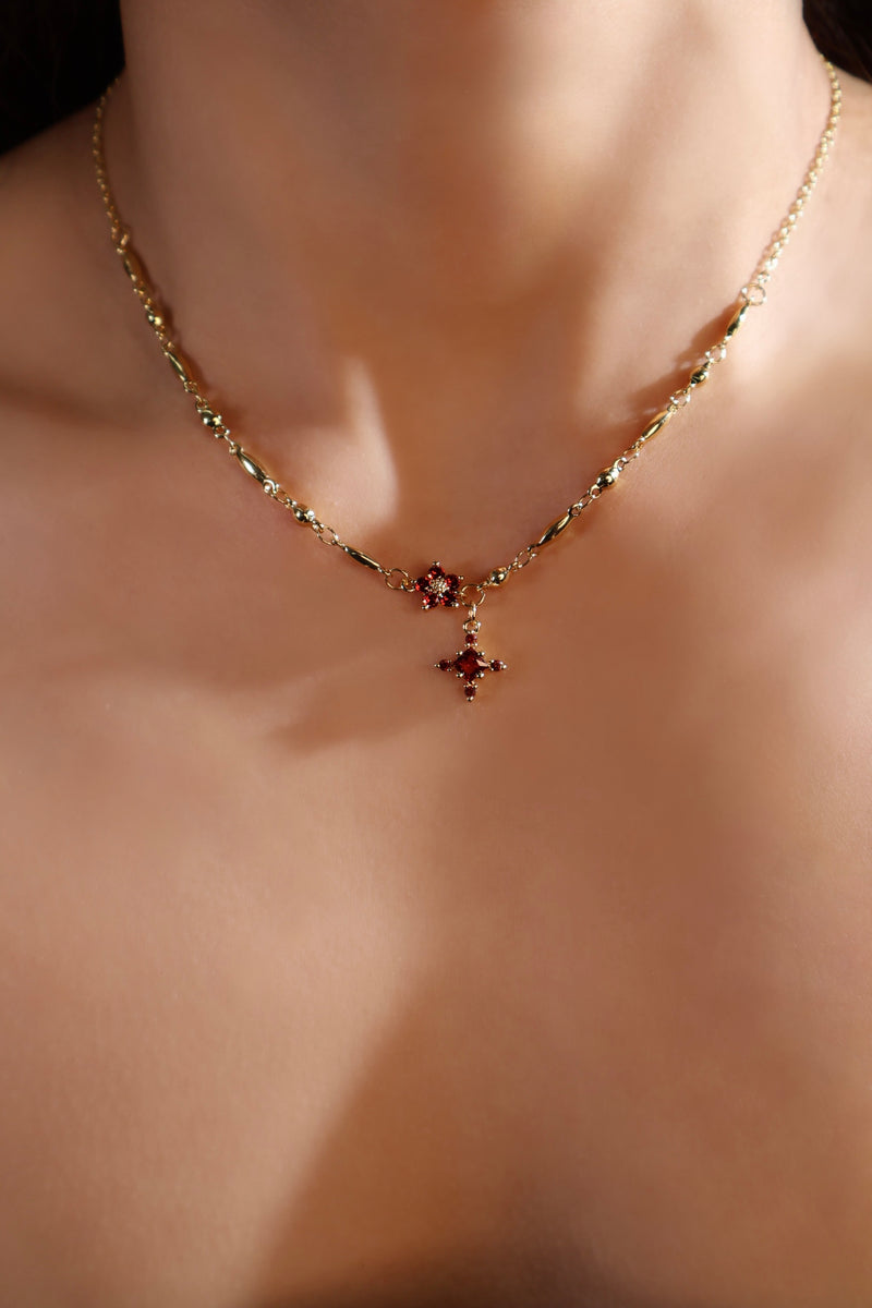 18K gold-plated cross necklace set with ruby-red zirconia gemstones
