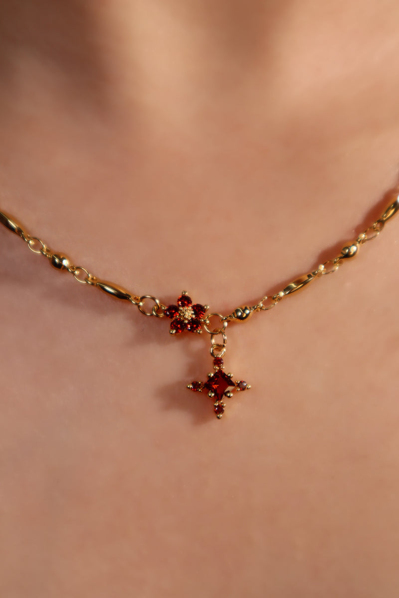 18K gold-plated cross necklace set with ruby-red zirconia gemstones