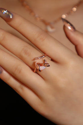 18K rose gold-plated snake ring wrapped around a zirconia moonstone