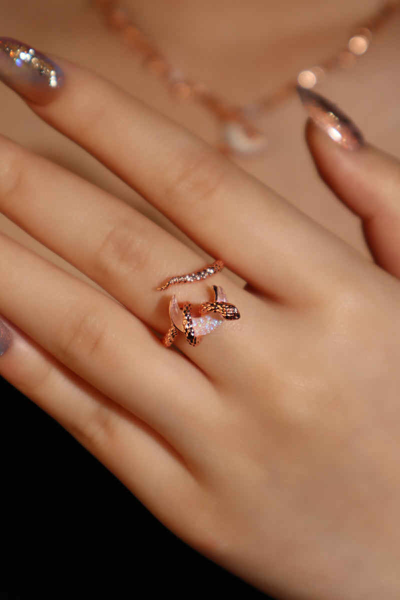 18K rose gold-plated snake ring wrapped around a zirconia moonstone