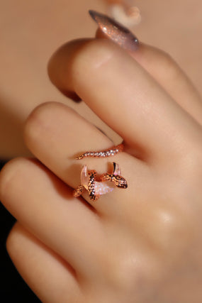 18K rose gold-plated snake ring wrapped around a zirconia moonstone