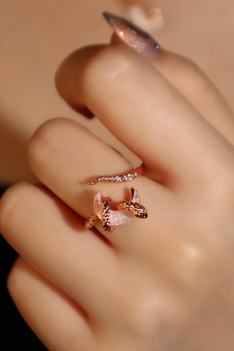 18K rose gold-plated snake ring wrapped around a zirconia moonstone