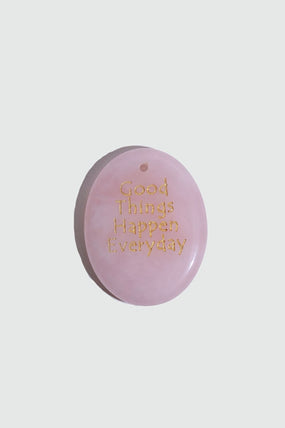Natural rose quartz stone pendant with a soft pink glow