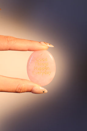 Natural rose quartz stone pendant with a soft pink glow