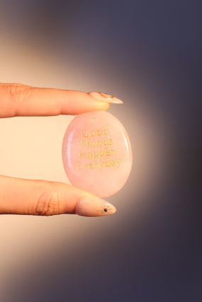 Natural rose quartz stone pendant with a soft pink glow