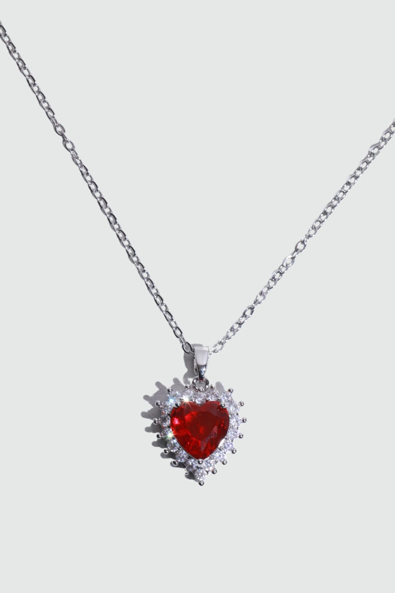 Palladium white gold plated necklace with a red heart gemstone framed in sparkling zirconia