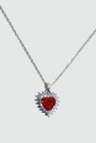 Palladium white gold plated necklace with a red heart gemstone framed in sparkling zirconia