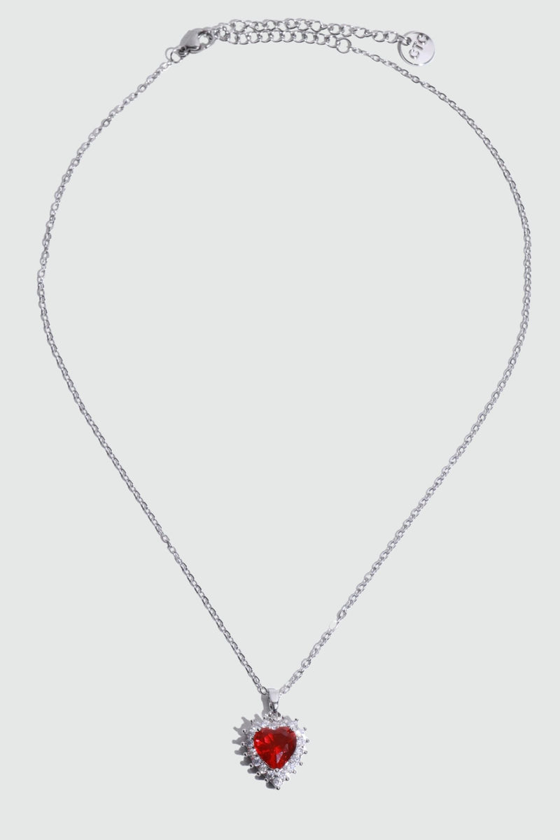 Palladium white gold plated necklace with a red heart gemstone framed in sparkling zirconia