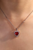 Palladium white gold plated necklace with a red heart gemstone framed in sparkling zirconia