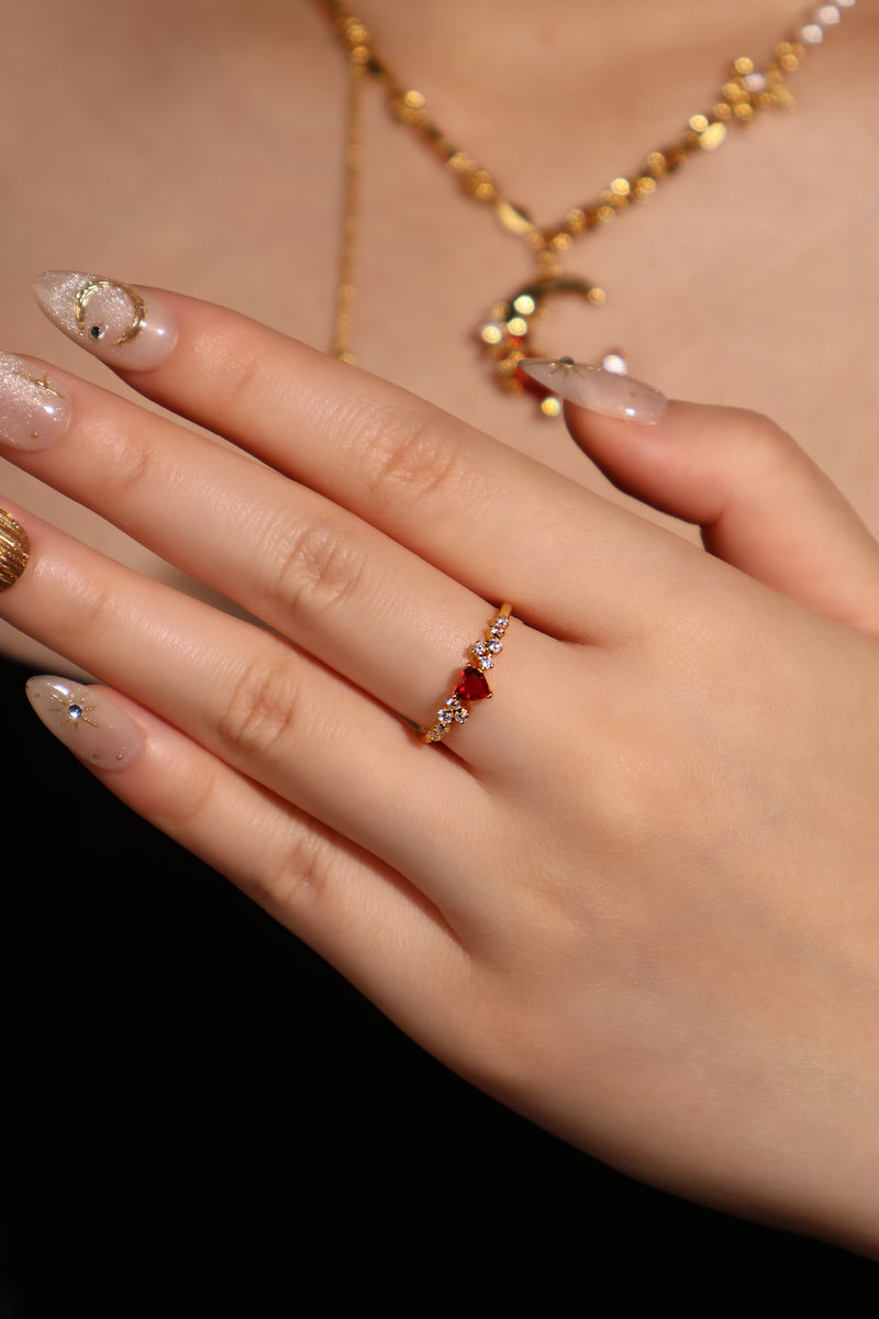 18K gold plated ring with a red crimson heart gemstone and sparkling zirconia on an adjustable band