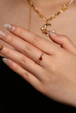 18K gold plated ring with a red crimson heart gemstone and sparkling zirconia on an adjustable band