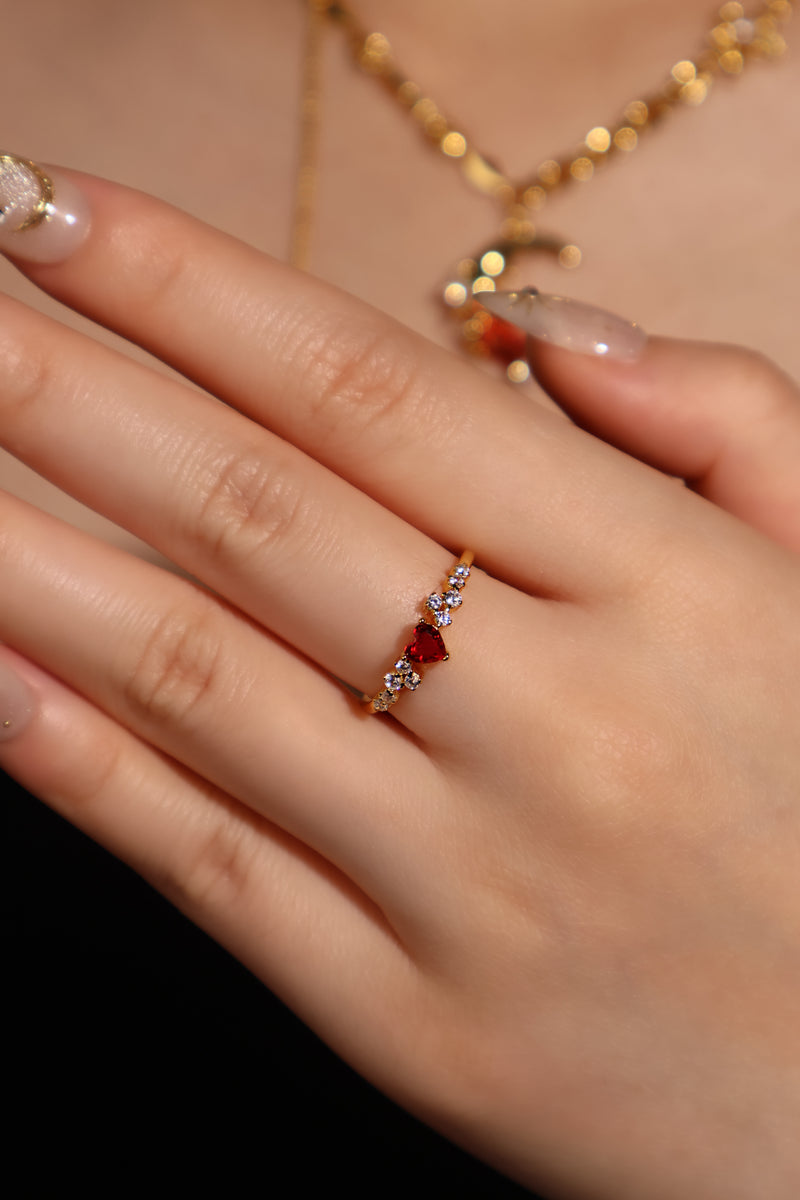 18K gold plated ring with a red crimson heart gemstone and sparkling zirconia on an adjustable band