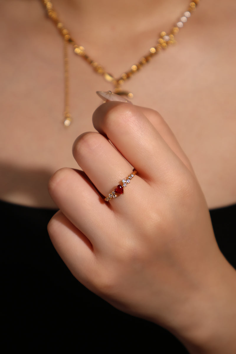 18K gold plated ring with a red crimson heart gemstone and sparkling zirconia on an adjustable band