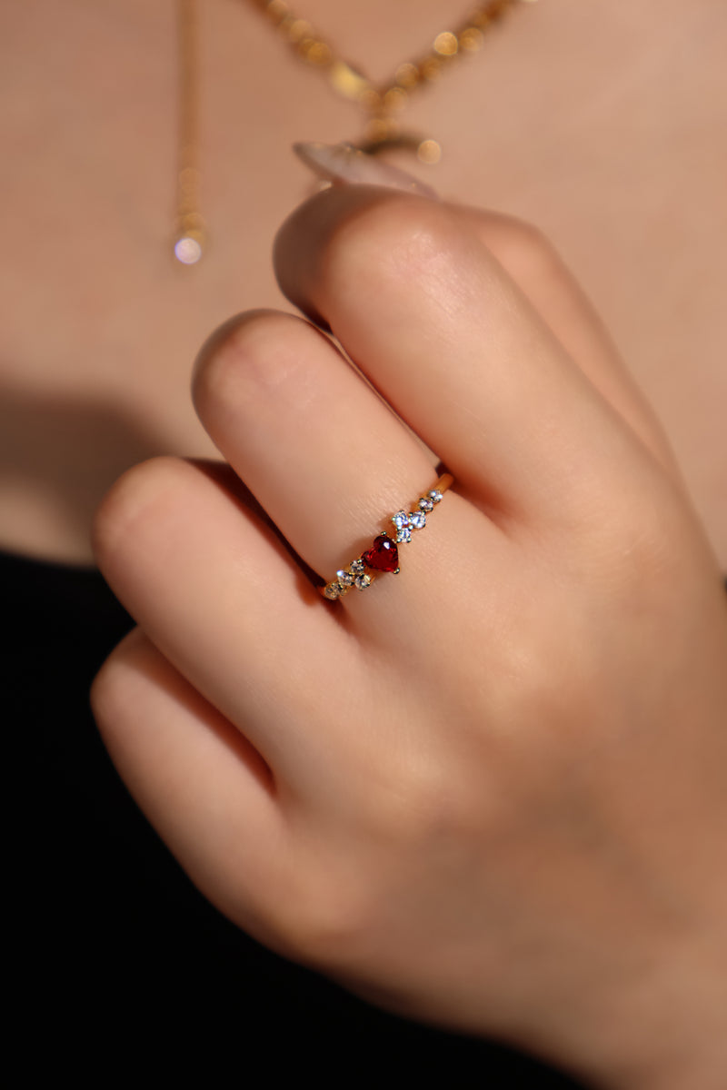 18K gold plated ring with a red crimson heart gemstone and sparkling zirconia on an adjustable band