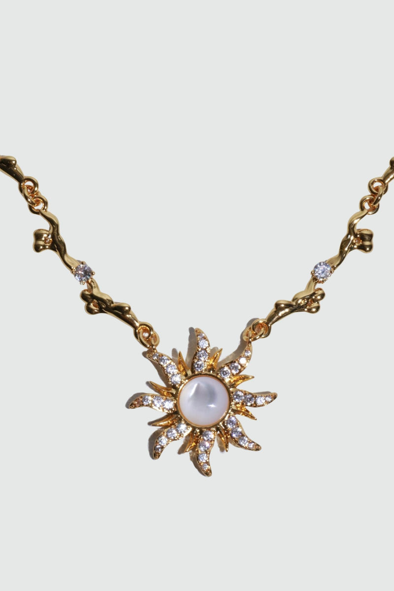 18K gold plated sun necklace with a white natural shell and sparkling zirconia