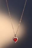 Palladium white gold plated necklace with a red heart gemstone framed in sparkling zirconia