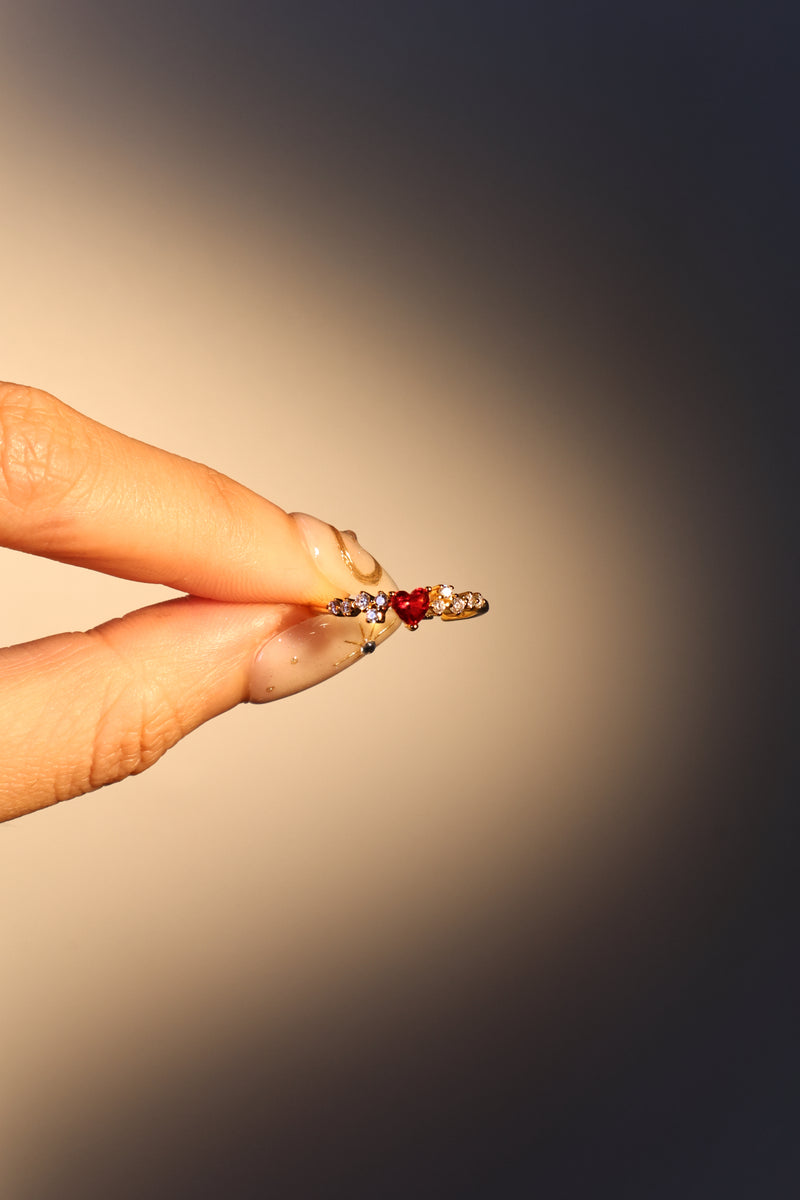 18K gold plated ring with a red crimson heart gemstone and sparkling zirconia on an adjustable band