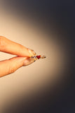18K gold plated ring with a red crimson heart gemstone and sparkling zirconia on an adjustable band
