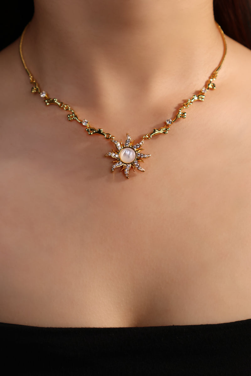 18K gold plated sun necklace with a white natural shell and sparkling zirconia