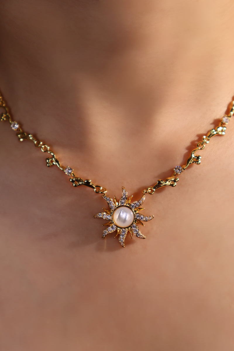 18K gold plated sun necklace with a white natural shell and sparkling zirconia
