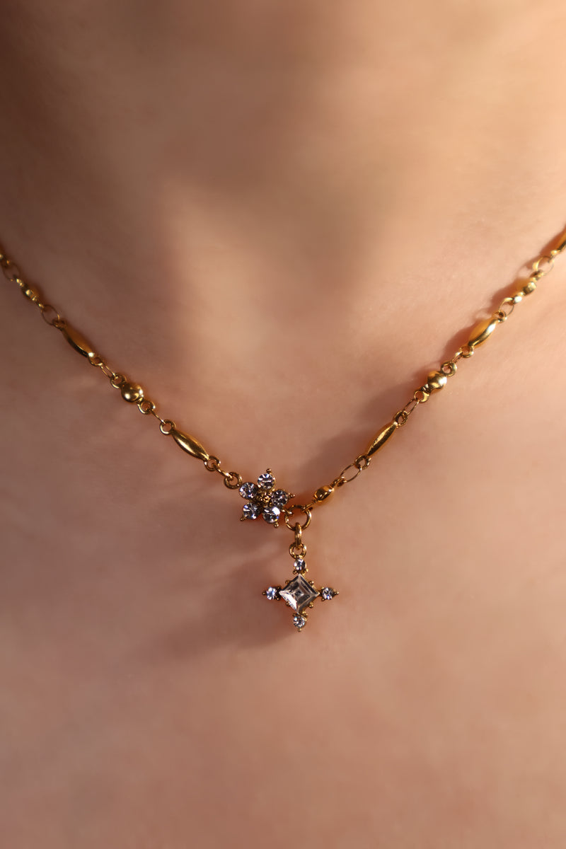 18K gold plated over stainless steel cross necklace with sparkling zirconia diamonds