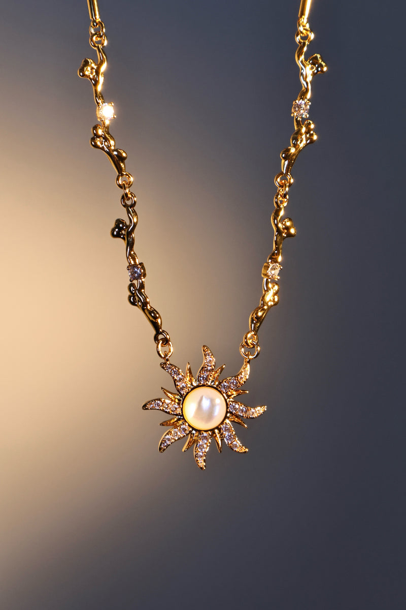 18K gold plated sun necklace with a white natural shell and sparkling zirconia