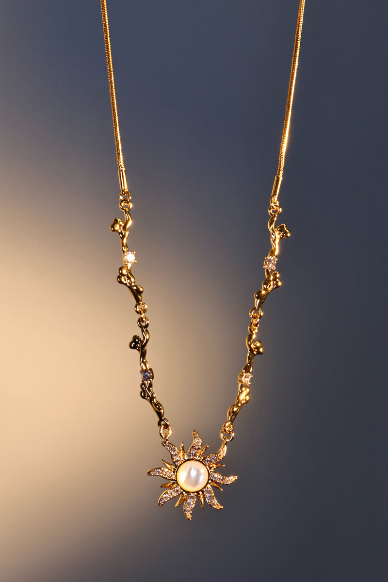 18K gold plated sun necklace with a white natural shell and sparkling zirconia