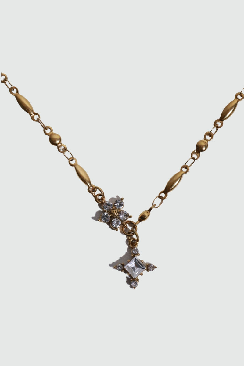 18K gold plated over stainless steel cross necklace with sparkling zirconia diamonds