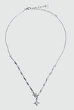 Stainless steel cross necklace traced with sparkling zirconia diamonds like scattered starlight
