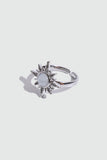 Silver plated sun ring with a glowing white zirconia moonstone and sparkling zirconia on an adjustable band