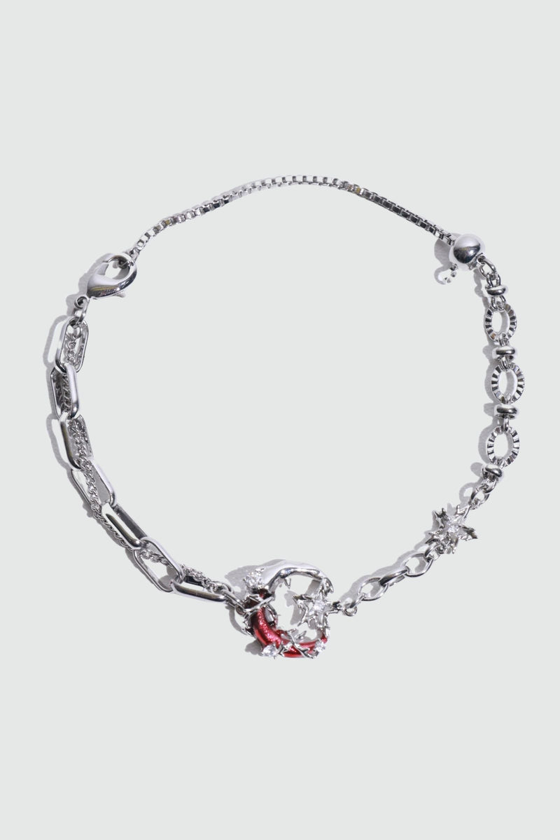 Silver plated bracelet with a glowing red resin crescent moon and sparkling zirconia