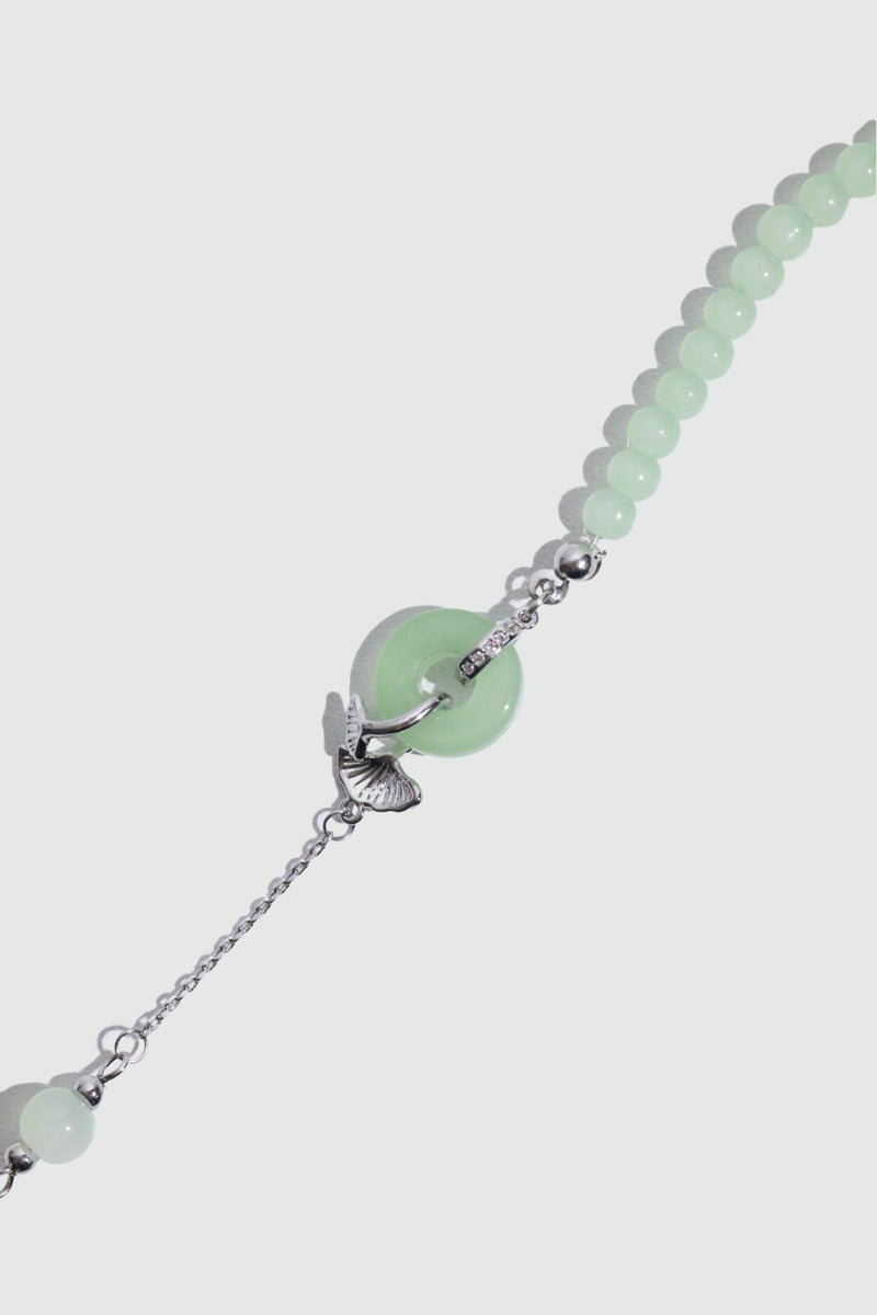 Palladium white gold plated bracelet with a jade ginkgo leaf and sparkling zirconia diamonds