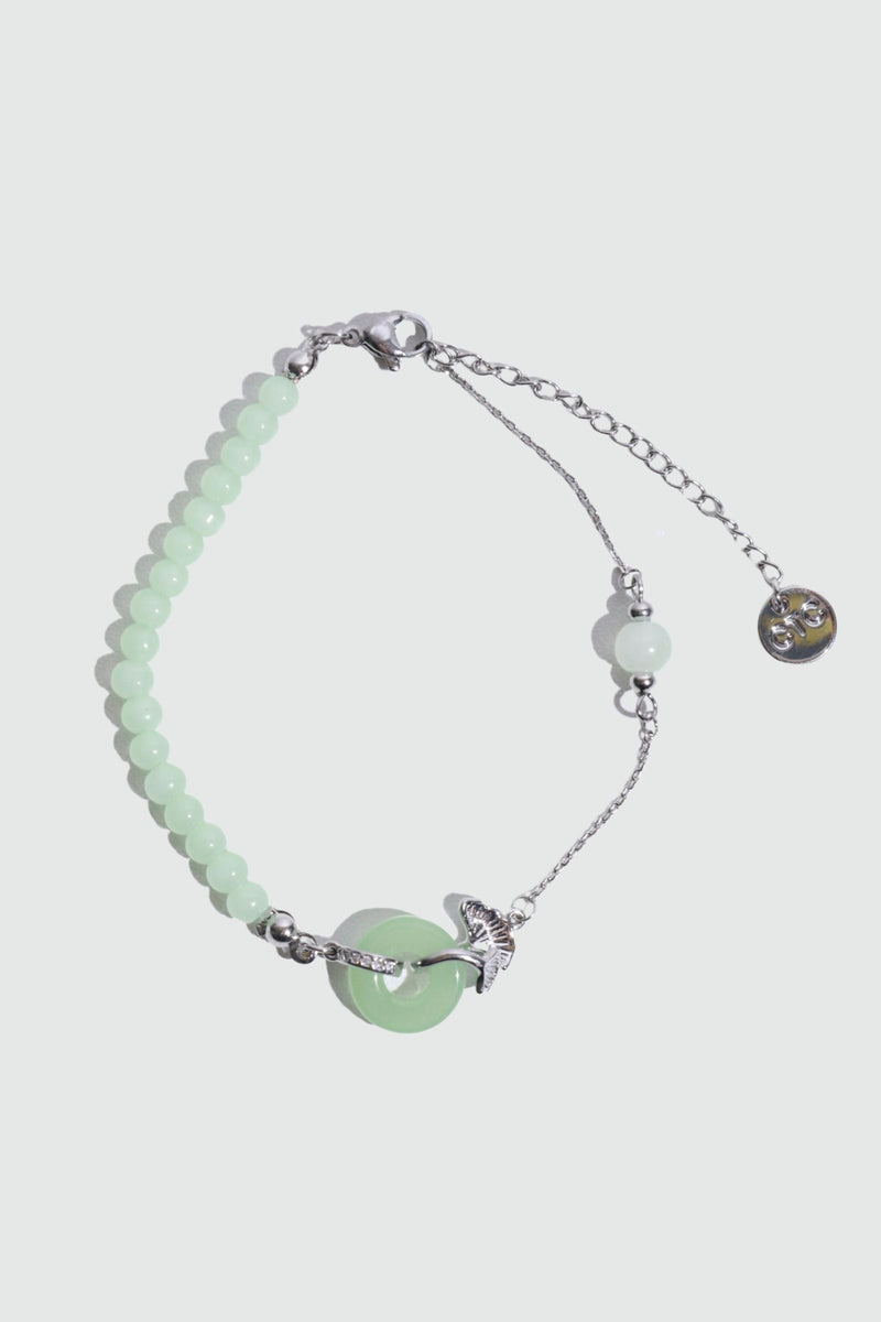 Palladium white gold plated bracelet with a jade ginkgo leaf and sparkling zirconia diamonds