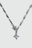 Stainless steel cross necklace traced with sparkling zirconia diamonds like scattered starlight