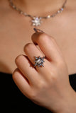 Silver plated sun ring with a glowing white zirconia moonstone and sparkling zirconia on an adjustable band