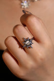 Silver plated sun ring with a glowing white zirconia moonstone and sparkling zirconia on an adjustable band