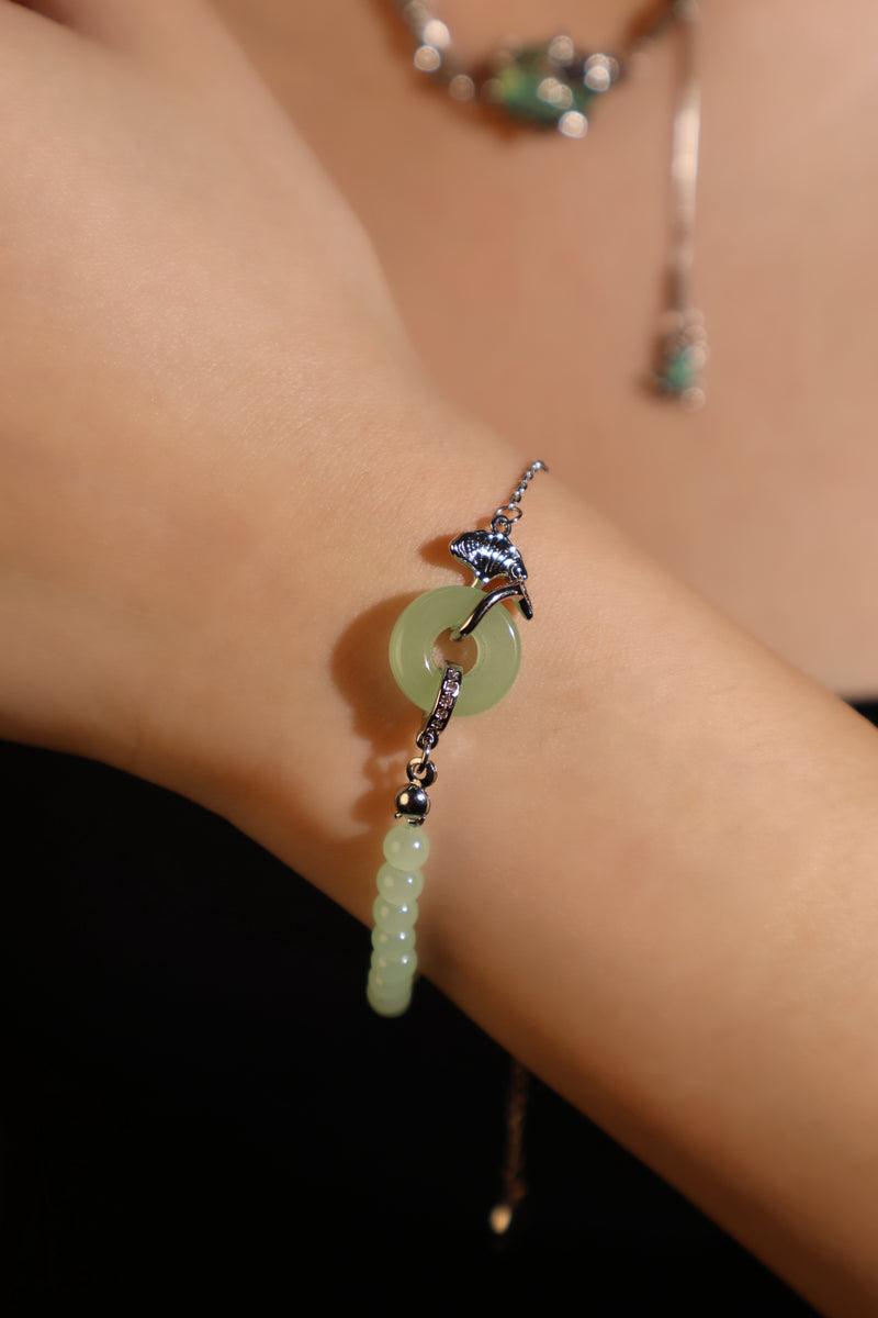 Palladium white gold plated bracelet with a jade ginkgo leaf and sparkling zirconia diamonds