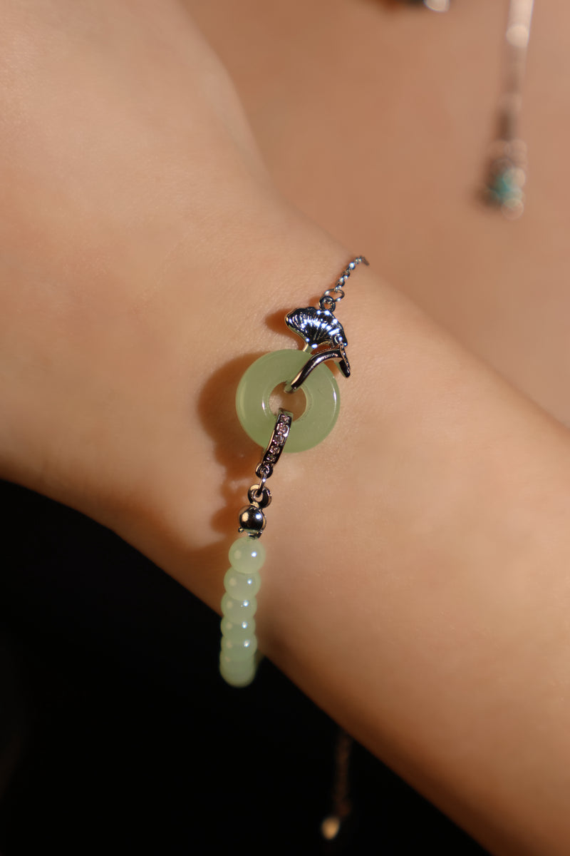 Palladium white gold plated bracelet with a jade ginkgo leaf and sparkling zirconia diamonds