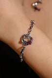 Silver plated bracelet with a glowing red resin crescent moon and sparkling zirconia