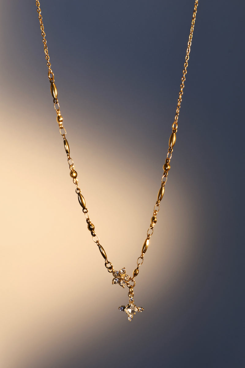 18K gold plated over stainless steel cross necklace with sparkling zirconia diamonds