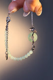 Palladium white gold plated bracelet with a jade ginkgo leaf and sparkling zirconia diamonds