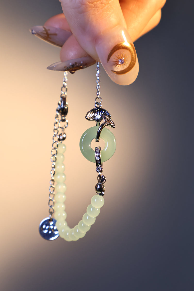 Palladium white gold plated bracelet with a jade ginkgo leaf and sparkling zirconia diamonds